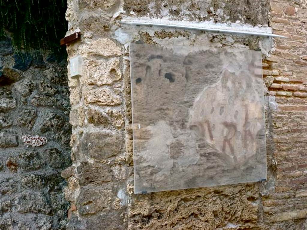 III.1.1 Pompeii. June 2012. Detail of the remains of painted graffiti between III.1.1 and III.1.2. Photo courtesy of Michael Binns.
