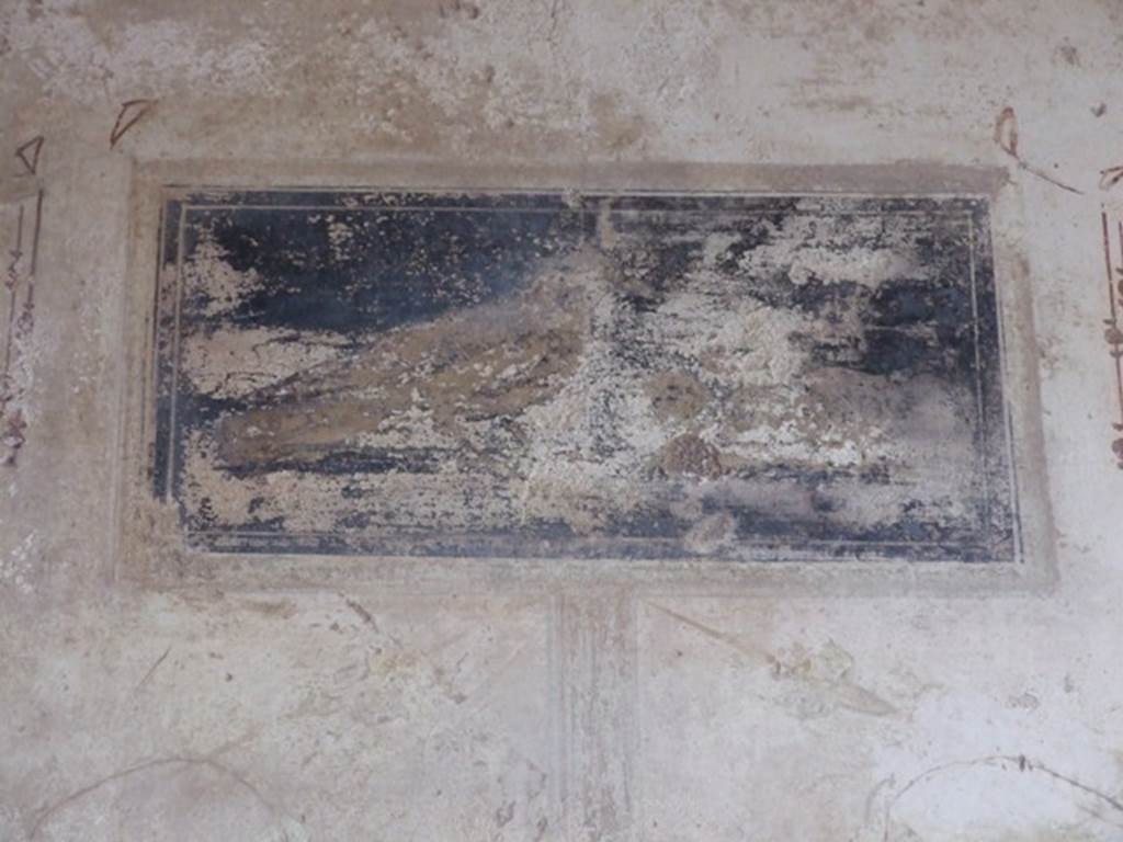 III.2.1 Pompeii.  March 2009.  Room 9.  Tablinum.  Remains of painted panel on upper section of east wall.