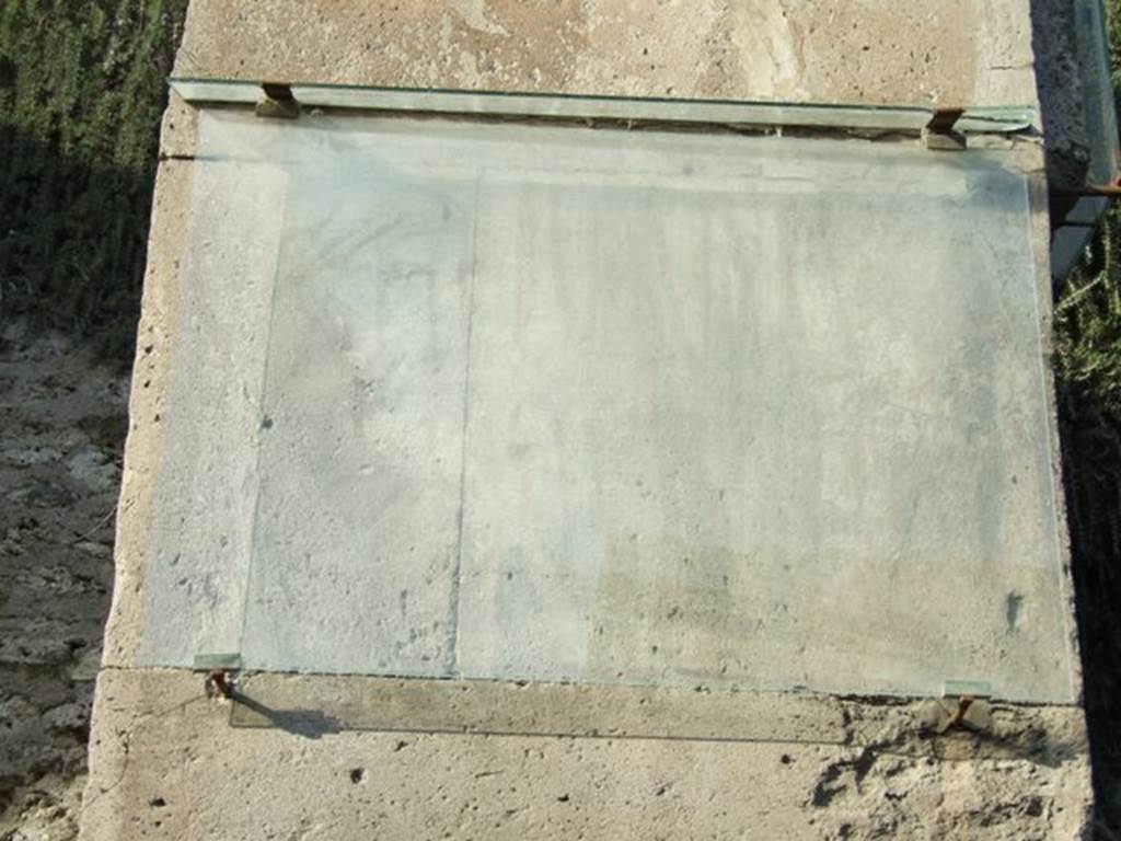 III.3.1 Pompeii. December 2007. Graffiti or inscription on west pilaster, the left side of the front wall.    According to Varone and Stefani, this faded painted graffito was CIL IV 7638.  They add the note that V O F as found in 7638 (and not O V F as is usually found) was also found in CIL IV 7889 in a different place.  Also on the same pilaster was CIL IV 7640.  According to Varone and Stefani, on the right pilaster, between III.3.1 and III.3.2 would have been – CIL IV 7642 and 7643.  Only a very faint outline exists of CIL IV 7638, none of the others are conserved.   See Varone, A. and Stefani, G., 2009. Titulorum Pictorum Pompeianorum, Rome: L’erma di Bretschneider, (p.242-244 with photos).
Della Corte says that there are two recommendations written on the entrance:
Tigil(lus) fa[cit]     [CIL IV 7639]
[Ti]gi[ll]us, Veterarius, rogat    [CIL IV 7643]   (this has a note that Diehl, no.961 proposed the name as being Epictetus)
See Della Corte, M., 1965.  Case ed Abitanti di Pompei. Napoli: Fausto Fiorentino. (p. 350)
According to Epigraphik-Datenbank Clauss/Slaby (See www.manfredclauss.de), these read as –
Cn(aeum)   Helvium  
Sabinum  aed(ilem) 
v(os!)  o(ro)  f(aciatis)      [CIL IV 7638]
[M(arcum)  Licinium]  Romanu[m]      [CIL IV 7640]
N(umerium)  P(opidium)  R(ufum)  IIvir(um) 
Vicini  rog(ant)      [CIL IV 7642]
A(ulum)  Suettium  Verum 
aed(ilem) o(ro) v(os) f(aciatis) [3]ct() [3]us 
veterarius rogat       [CIL IV 7643]
[Ve]rum 
/
aed(ilem) 
Ticii[3] 
fac[it]        [CIL IV 7639]
