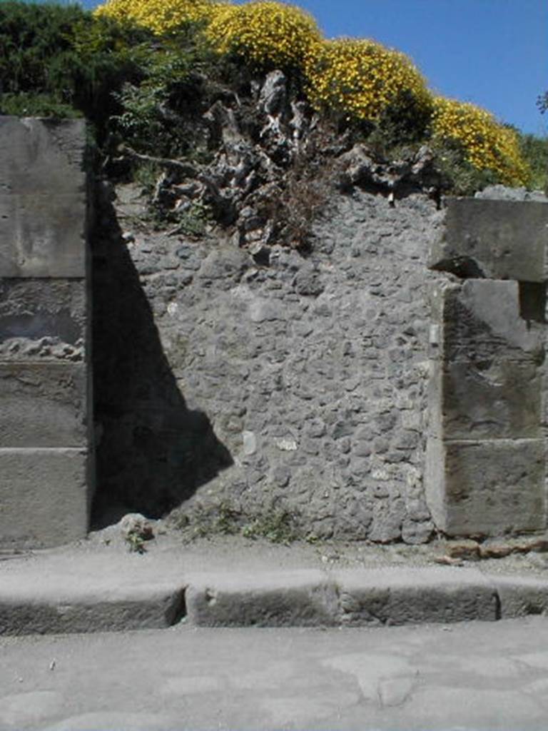 III.3.2 Pompeii. May 2005. Entrance doorway, partly excavated.
According to Varone and Stefani, on the left pilaster, between III.3.1 and III.3.2 would have been CIL IV 7642 and 7643, which are not conserved.

N(umerium) P(opidium) R(ufum) IIvir(um) 
vicini  rog(ant)      [CIL IV 7642]

A(ulum) Suettium Verum 
aed(ilem) o(ro) v(os) f(aciatis) [3]ct() [3]us 
veterarius rogat       [CIL IV 7643]

See Varone, A. and Stefani, G., 2009. Titulorum Pictorum Pompeianorum, Rome: LErma di Bretschneider, (p.242-244 with photos).
See Epigraphik-Datenbank Clauss/Slaby (www.manfredclauss.de).
