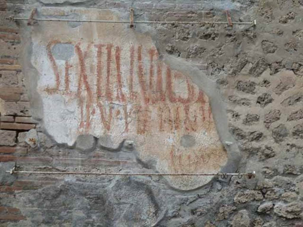 III.4.3 Pompeii. May 2010. CIL IV 7711 at east end of front wall.
According to Epigraphik-Datenbank Clauss/Slaby (See www.manfredclauss.de), this read as 
L(ucium)  Sextilium 
[                                    [CIL IV 7711]
According to a note of Varone and Stefani, this has now become more readable 
L. Sextilium Sy[rticum] 
II V.I.D. [P]inariu[s]
[]                               [CIL IV 7711]
See Varone, A. and Stefani, G., 2009. Titulorum Pictorum Pompeianorum, Rome: Lerma di Bretschneider, (p.272)

