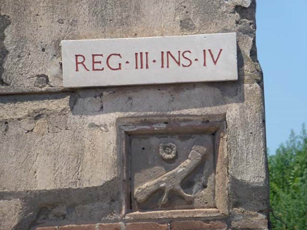 III.4.3 Pompeii. June 2012. Plaque on east end of insula, in south-east corner. Photo courtesy of Michael Binns. On the front wall at the east end, under the plaque CIL IV 7708, 7709 and 7710 were found. None of these are conserved.
See Varone, A. and Stefani, G., 2009. Titulorum Pictorum Pompeianorum, Rome: L’erma di Bretschneider, (p.270-71)

According to Epigraphik-Datenbank Clauss/Slaby (See www.manfredclauss.de), these read as –

Cn(aeum) Helvium Sabin(us) / aed(ilem) Epidius cum suis / vol(t) et probat       [CIL IV 7708]
N(umerium) Popidium II(virum) i(ure) d(icundo) / Epidius rogat       [CIL IV 7709]
M(arcum) Casellium et / Albucium aed(iles)       [CIL IV 7710]

According to Cooley, CIL IV 7708 translated as –
Epidius with his household want and support Cn. Helvius Sabinus as aedile.
See Cooley, A. and M.G.L., 2004. Pompeii : A Sourcebook. London : Routledge. (p.121, F36)
