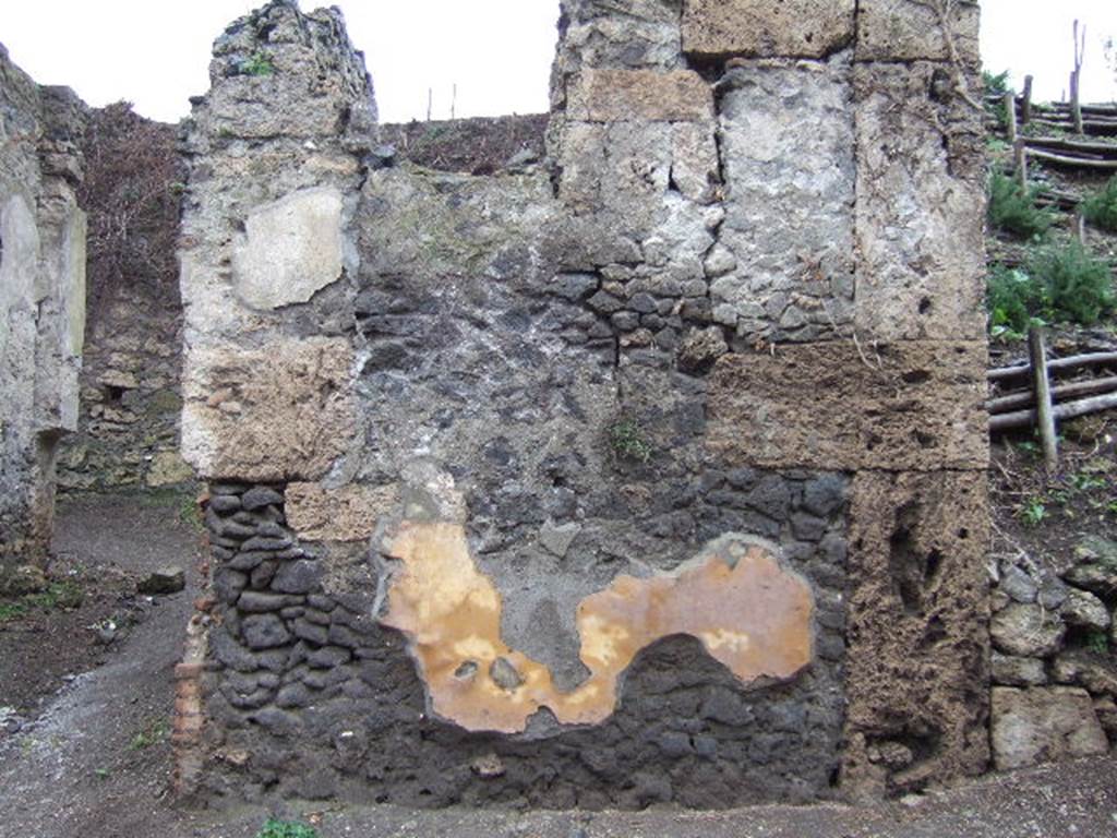 III.6.2 Pompeii. December 2005. Remains of painted plaster. On this wall CIL IV 7995, 7757 and 7758 were found.  According to Garcia y Garcia, the bomb that fell to the north of this entrance on the unexcavated land did not cause a lot of damage there.  However the beautiful inscriptions to the right of the entrance here were completely lost.   See Garcia y Garcia, L., 2006. Danni di guerra a Pompei. Rome: L’Erma di Bretschneider. (p.60-61)  See Varone, A. and Stefani, G., 2009. Titulorum Pictorum Pompeianorum, Rome: L’erma di Bretschneider, (p.282-3)
According to Epigraphik-Datenbank Clauss/Slaby (See www.manfredclauss.de), the graffiti read as –
D(ecimi)  Lucreti  Satri 
Valentis  flaminis  [[Neronis]]  Caesaris  Augusti  f(ilii)  perpetui  glad(iatorum)  par(ia)  XX  et 
D(ecimi)  Lucreti  Valentis  fili(i)  [glad(iatorum)]  par(ia)  X 
ex  a(nte)  d(iem)  V  K(alendam)  April(es)  venation  et  vela  er[unt]        [CIL IV7995]   The graffiti was in black and red, from around AD 50-68, the name of Nero [[Neronis]] was plastered over, perhaps after he committed suicide in AD 68.  This translates as -  20 pairs of gladiators of Decimus Lucretius Satrius Valens, perpetual priest of ((Nero)) Caesar, son of Augustus, and 10 pairs of (gladiators) of Decimus Lucretius Valens, his son, on 28 March. There will be a hunt and awnings. See Cooley, A. and M.G.L., 2004. Pompeii : A Sourcebook. London : Routledge. (p.52)
D(ecimum)  Luc(retium)  V(alentem)  v(irum)  b(onum) 
/ 
d(uum)v(irum)  d(ignum)  r(ei)  p(ublicae)  
vicini  faciunt       [CIL IV 7757]
Paquium  et  Caprasium  d(uumviros)  i(ure)  d(icundo)  o(ro)  v(os)  f(aciatis)      [CIL IV 7758]
