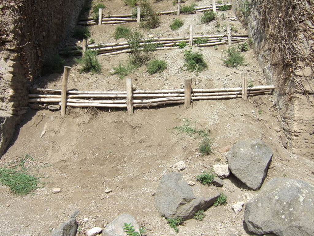 III.6.6 Pompeii. September 2005.   Unexcavated roadway, looking north.         III.7