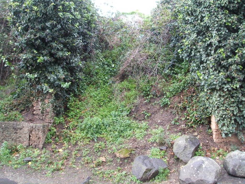 III.6.6 Pompeii. December 2004. Unexcavated roadway,looking north.III.7.