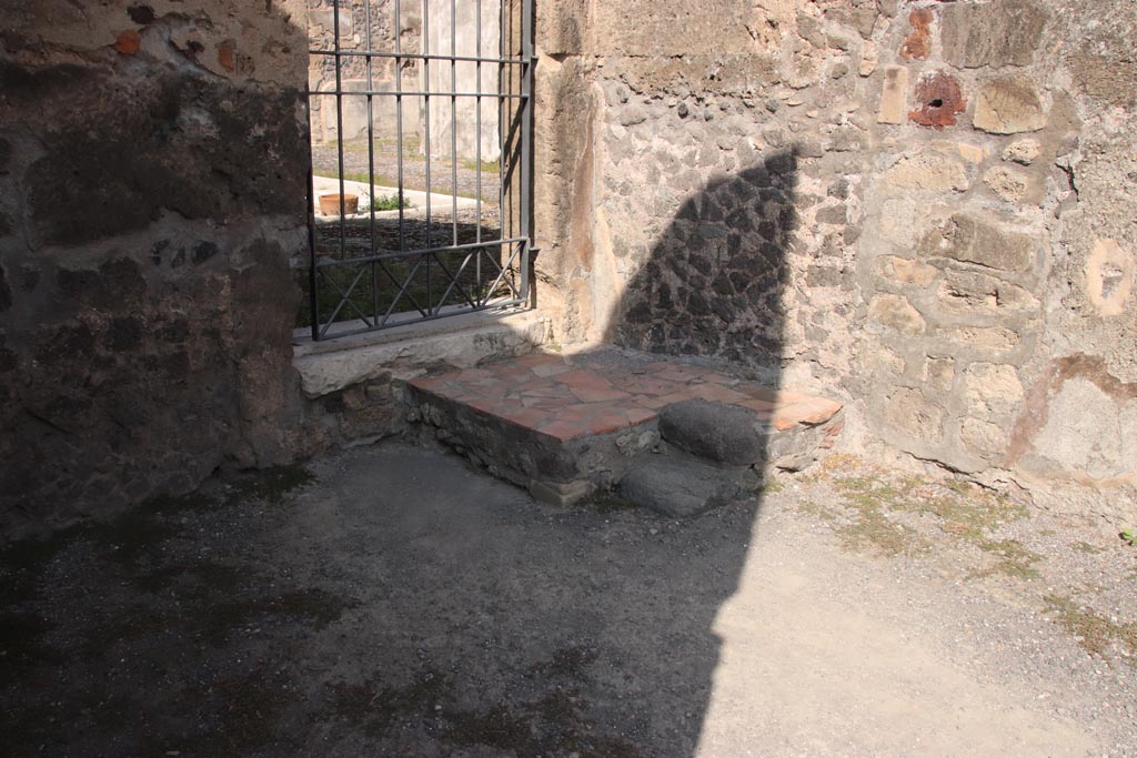V.1.6 Pompeii. October 2023. North-east corner of shop-room, and doorway into V.1.7. Photo courtesy of Klaus Heese.