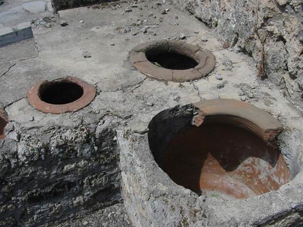 V.1.13 Pompeii. May 2003. Detail of three of the six remaining urns. Photo courtesy of Nicolas Monteix.