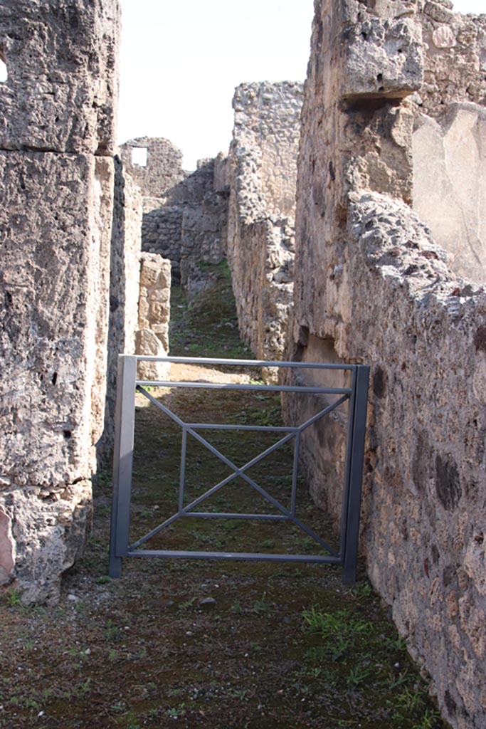 V.1.13 Pompeii. October 2023. Looking east along corridor to rear. Photo courtesy of Klaus Heese.