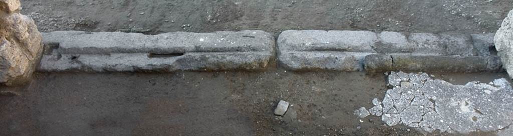 V.1.17 Pompeii. Post 2005. Doorway threshold of workshop. Photo by Hans Thorwid.
Photo courtesy of the Swedish Pompeii Project.
