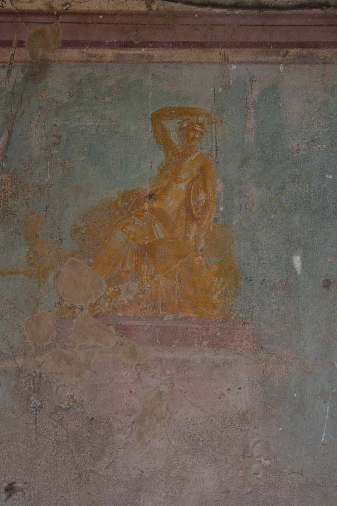 V.1.18 Pompeii. October 2019. 
Exedra “y”, painting of golden seated figure in centre of east wall of exedra “y”, described as both Dionysus, or perhaps Arianna.
Foto Annette Haug, ERC Grant 681269 DÉCOR.

