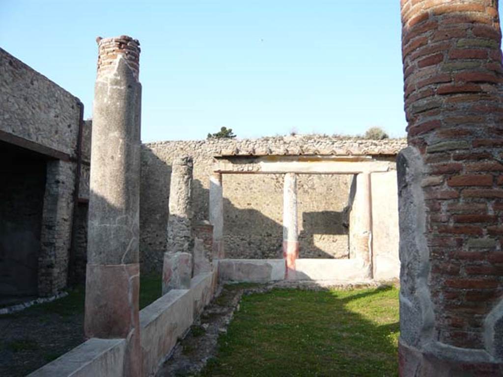 V.1.18 Pompeii. May 2012. Looking east along north portico of peristyle.
Photo courtesy of Buzz Ferebee. 
