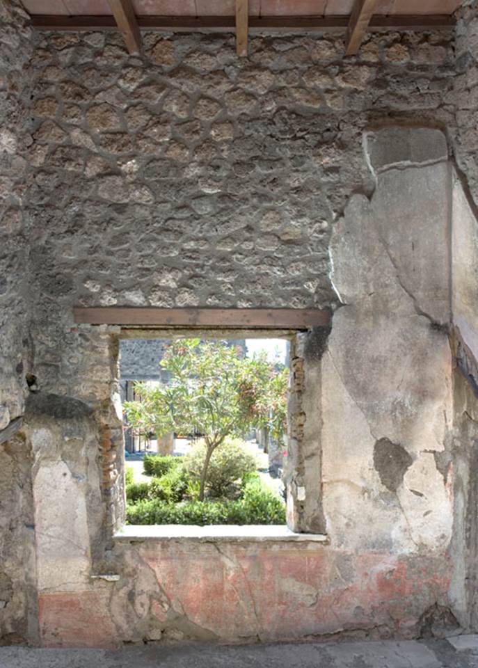 V.1.26 Pompeii. 2012. Room “s”, west wall with window onto peristyle. Photo by Hans Thorwid.
“West wall in 2012. Restored parts of the wall photographed and merge with the lower part and floor line of earlier photos of 2005-07.”
Photo and words courtesy of The Swedish Pompeii Project.
