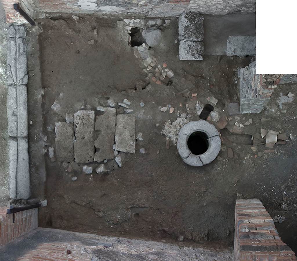 V.1.31 Pompeii. c.2009. Looking down onto flooring in shop-room 1. Photo by Hans Thorwid.
Photo courtesy of The Swedish Pompeii Project.
