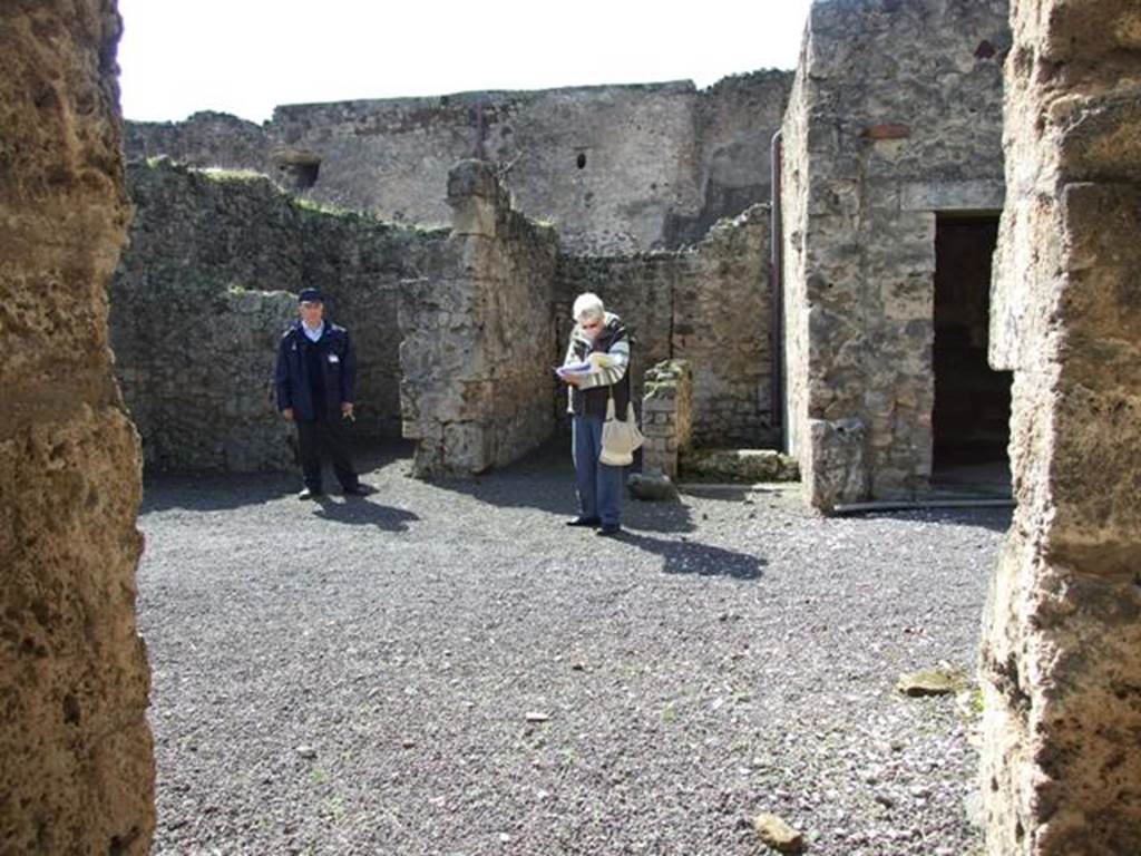 V.2.1 Pompeii. March 2009. Room 1, looking west towards doorways to rooms 5, 6 and 7 in atrium.
