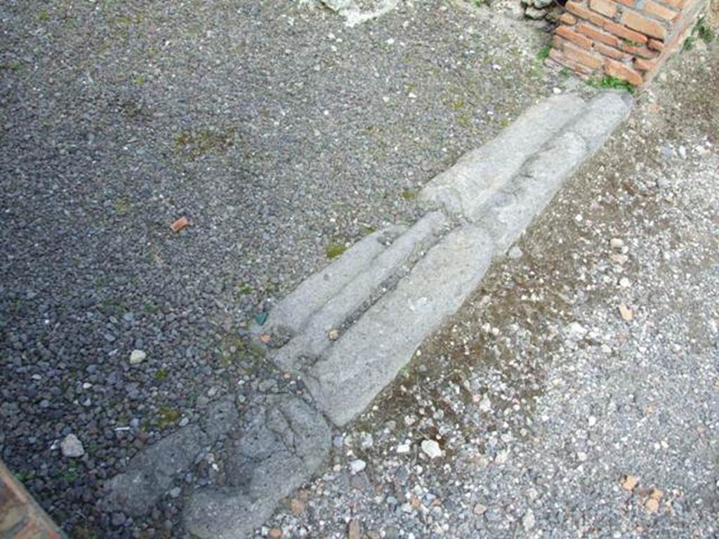 V.2.2 Pompeii.  March 2009. Sill or threshold of shop.