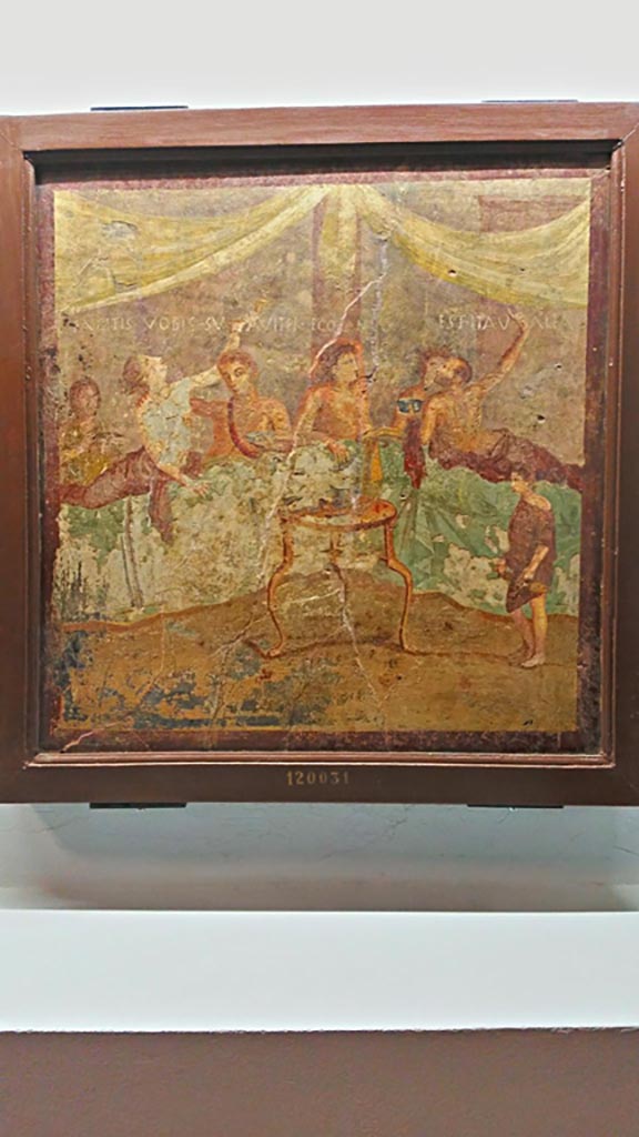V.2.4 Pompeii. Room 15, painting of banqueting scene from north wall of triclinium.
On display in Naples Archaeological Museum, inv. 120031. 
Photo courtesy of Giuseppe Ciaramella, June 2017.

