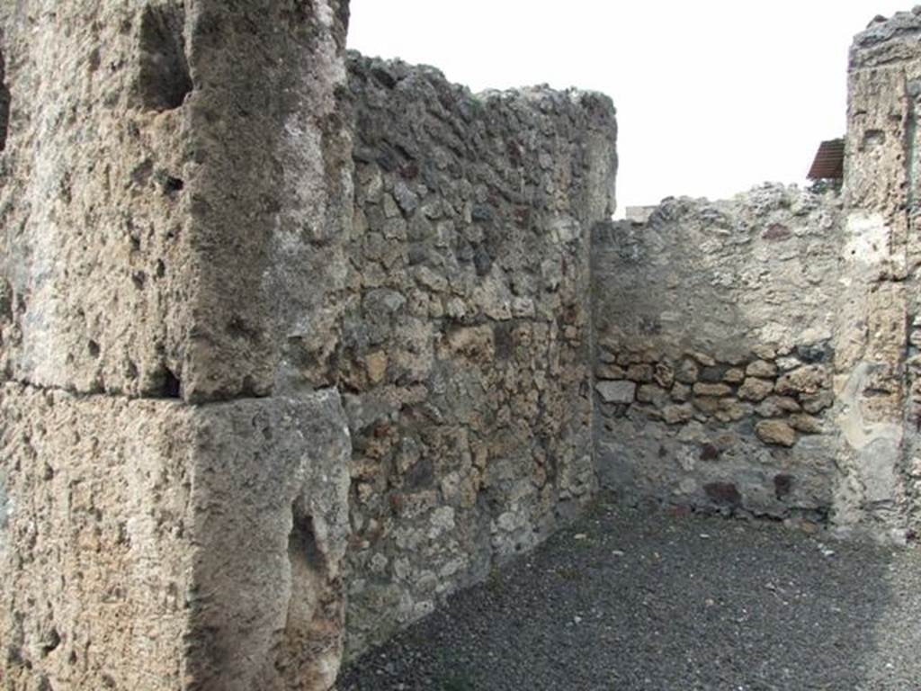 V.2.12 Pompeii.  March 2009.  West wall of shop.