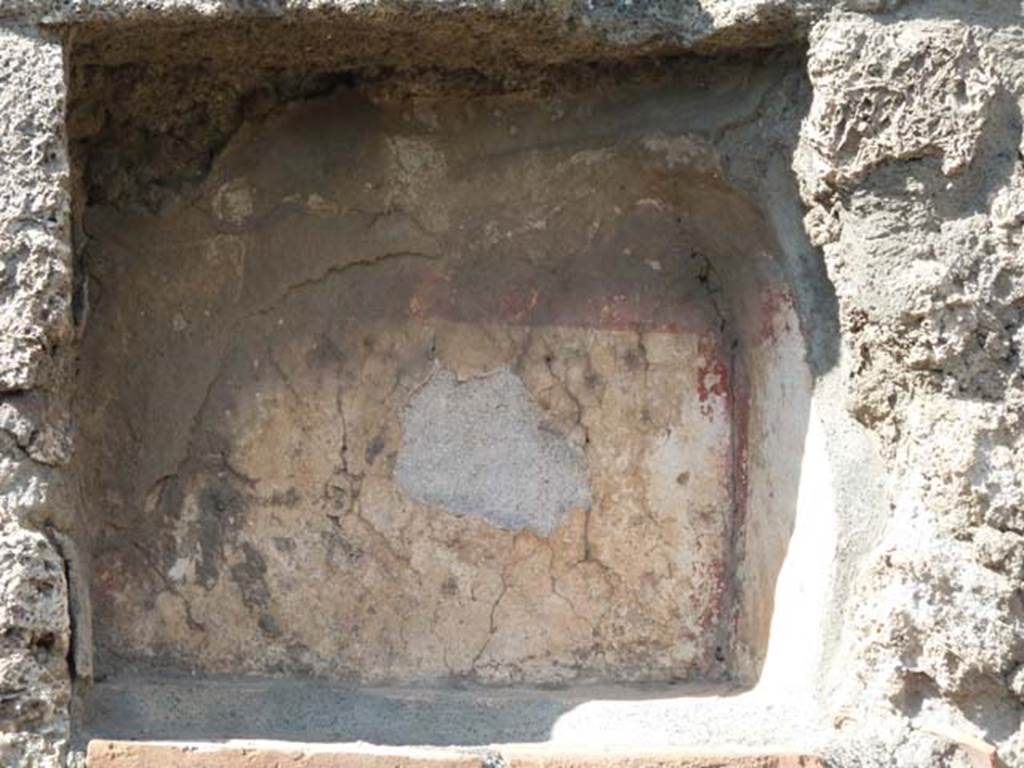 V.2.14 Pompeii. September 2015. Niche Lararium in north wall of shop.


