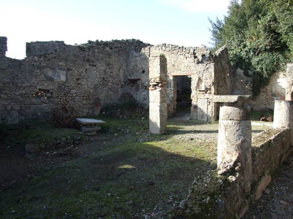 V.2.15 Pompeii. December 2007. Looking north-west across peristyle.  According to NdS, in the middle of the peristyle was the area for the flowers. Near the west wall was a masonry triclinium which would have been protected by its own cover, perhaps a pergola. The pergola would have been supported by four columns clad in yellow plaster on which were painted vine leaves and bunches of grapes. The portico only surrounded the peristyle on its north and east sides.
