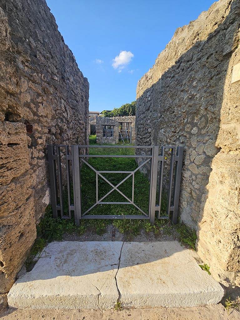 V.2.15 Pompeii. November 2024. 
Looking north along entrance corridor leading to atrium. Photo courtesy of Annette Haug.
