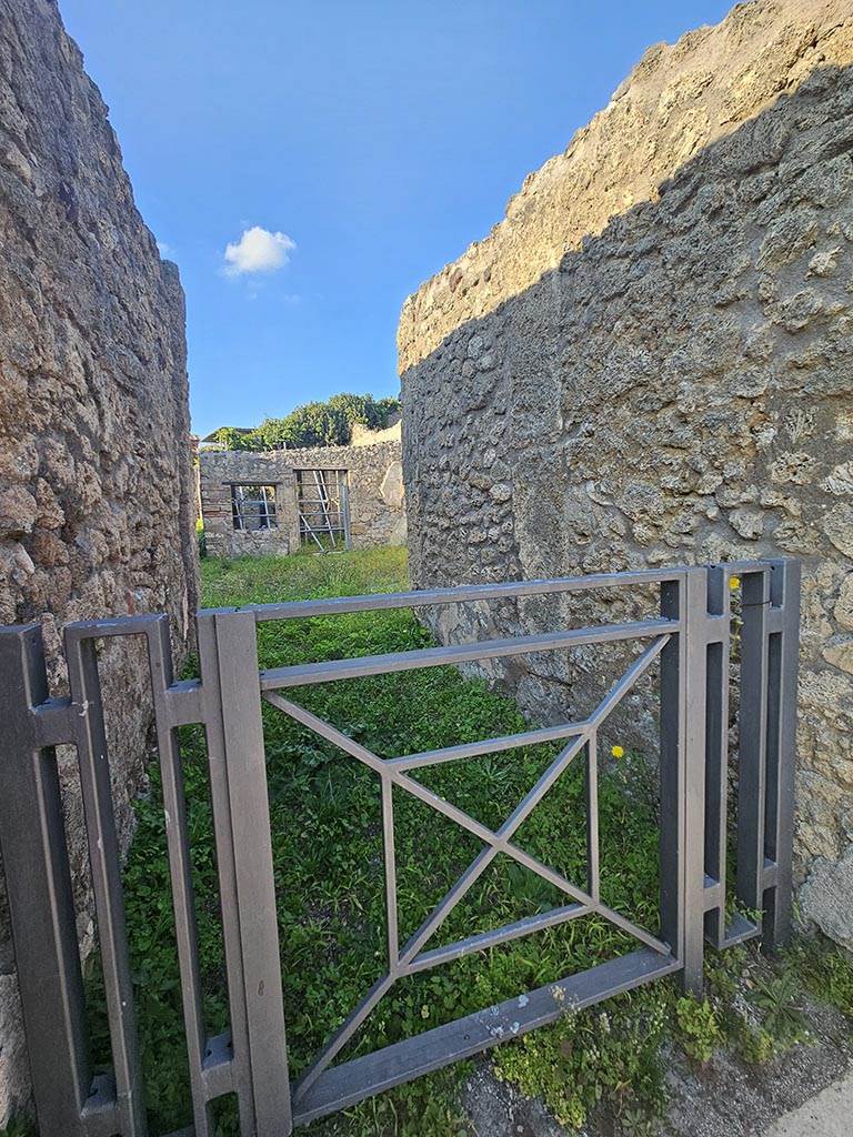 V.2.15 Pompeii. November 2024. 
Looking towards east wall of fauces/entrance corridor, on right. Photo courtesy of Annette Haug.

