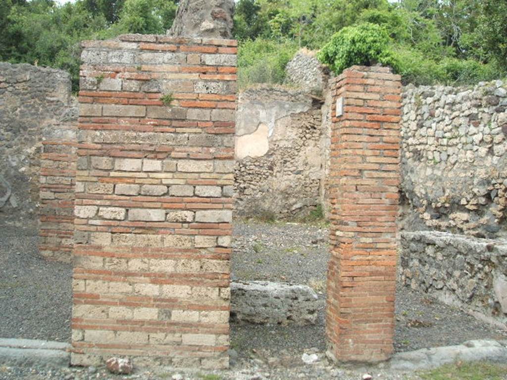V.2.18 Pompeii. May 2005. Steps to upper floor in centre of picture.