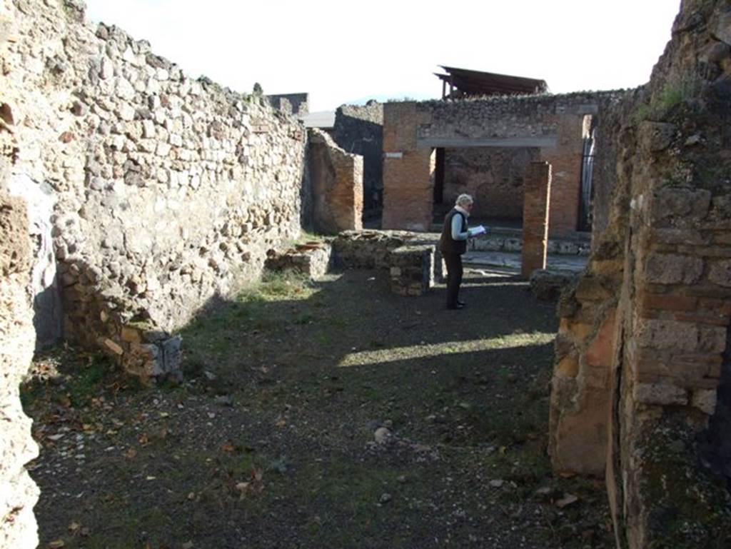 V.2.19 Pompeii. December 2007. Looking south across rear room towards entrance on Via di Nola, from doorway into V.2.20.  