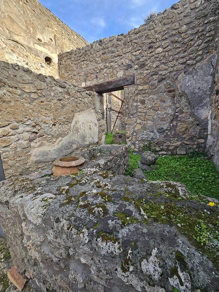V.2.b Pompeii. November 2024. 
Looking north-east across counter that would have had 3 urns. Photo courtesy of Annette Haug.
