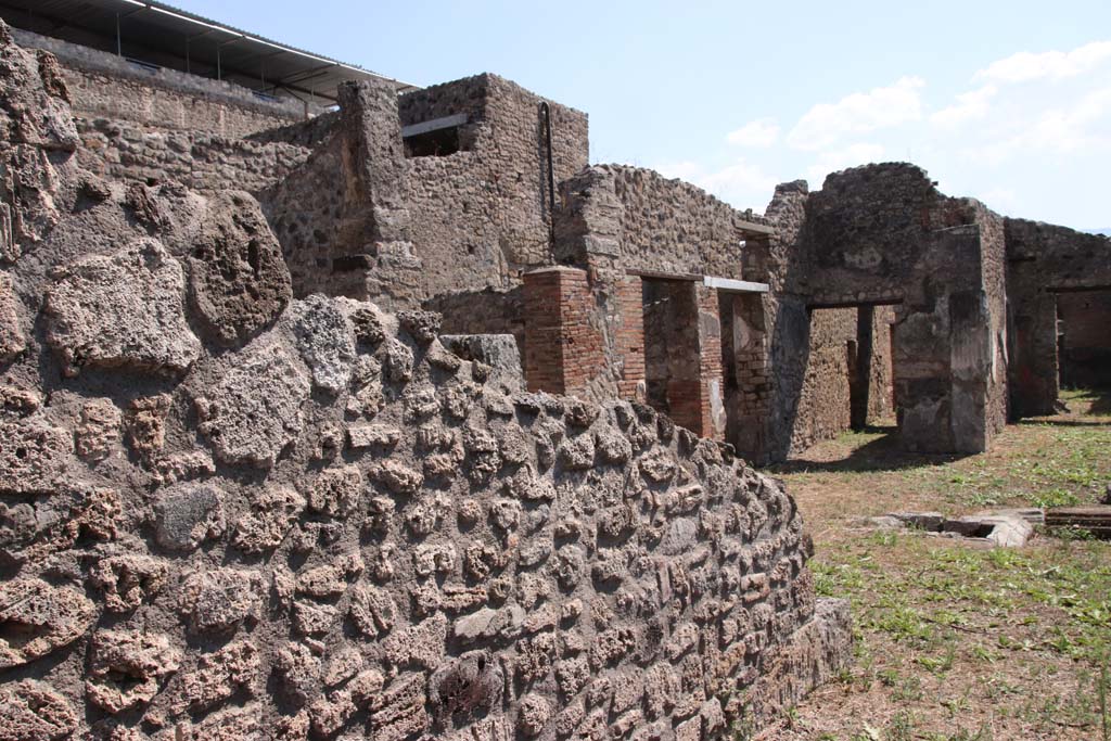 V.2.g Pompeii. September 2021. Looking south towards east side of atrium with doorway to corridor (l). Photo courtesy of Klaus Heese.

