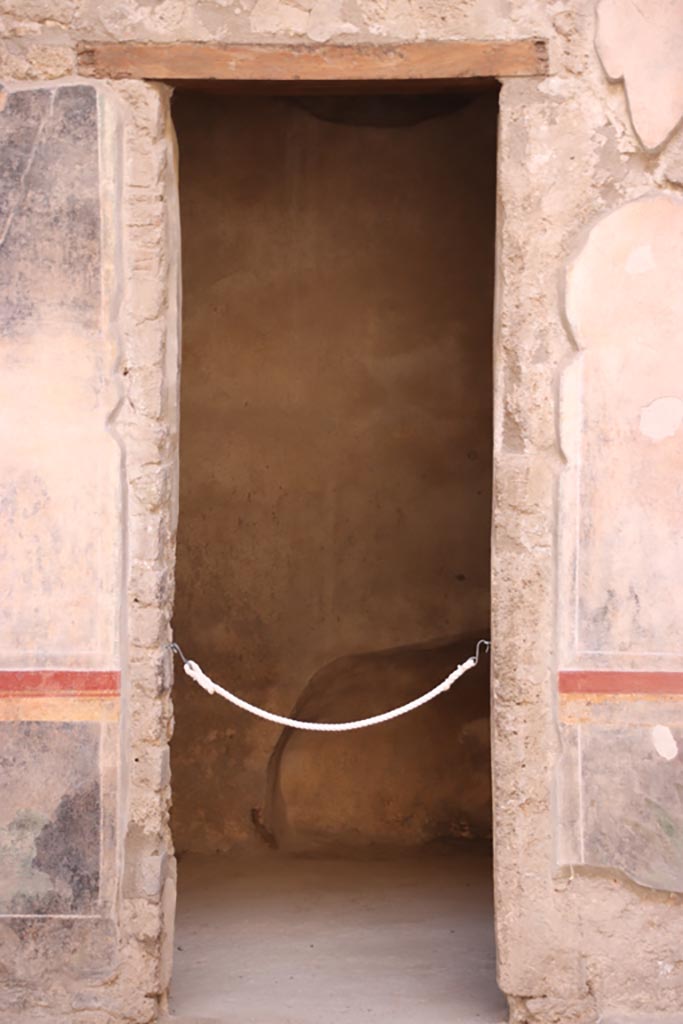 V.2.i Pompeii.  October 2023. Room 1, doorway to room 2c on west side of atrium. Photo courtesy of Klaus Heese.