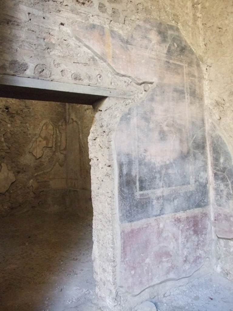 V.2.i Pompeii.  December 2007.  Room 8.  Ala.  Painted plaster on south wall at the side of doorway to room 9.
