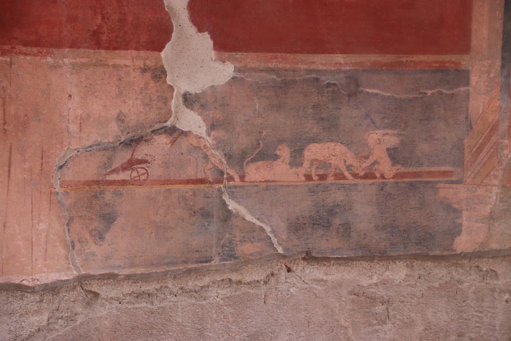 V.2.i Pompeii.  October 2023. 
Tablinum 7, painted panel in predella on east wall at north end, with black background. Photo courtesy of Klaus Heese.
