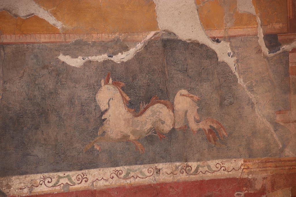 V.2.i Pompeii. October 2024.
Tablinum 7, detail of painted panel in predella on east wall, under yellow central panel. Photo courtesy of Klaus Heese.
