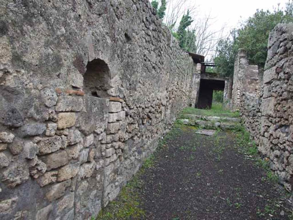 V.3.4 Pompeii, May 2010. West wall of entrance corridor, with blocked doorway to V.3.3