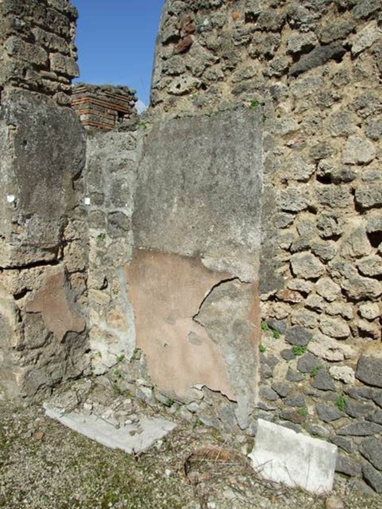 V.3.7 Pompeii.  March 2009.  Recess in the East wall, with marble sill?