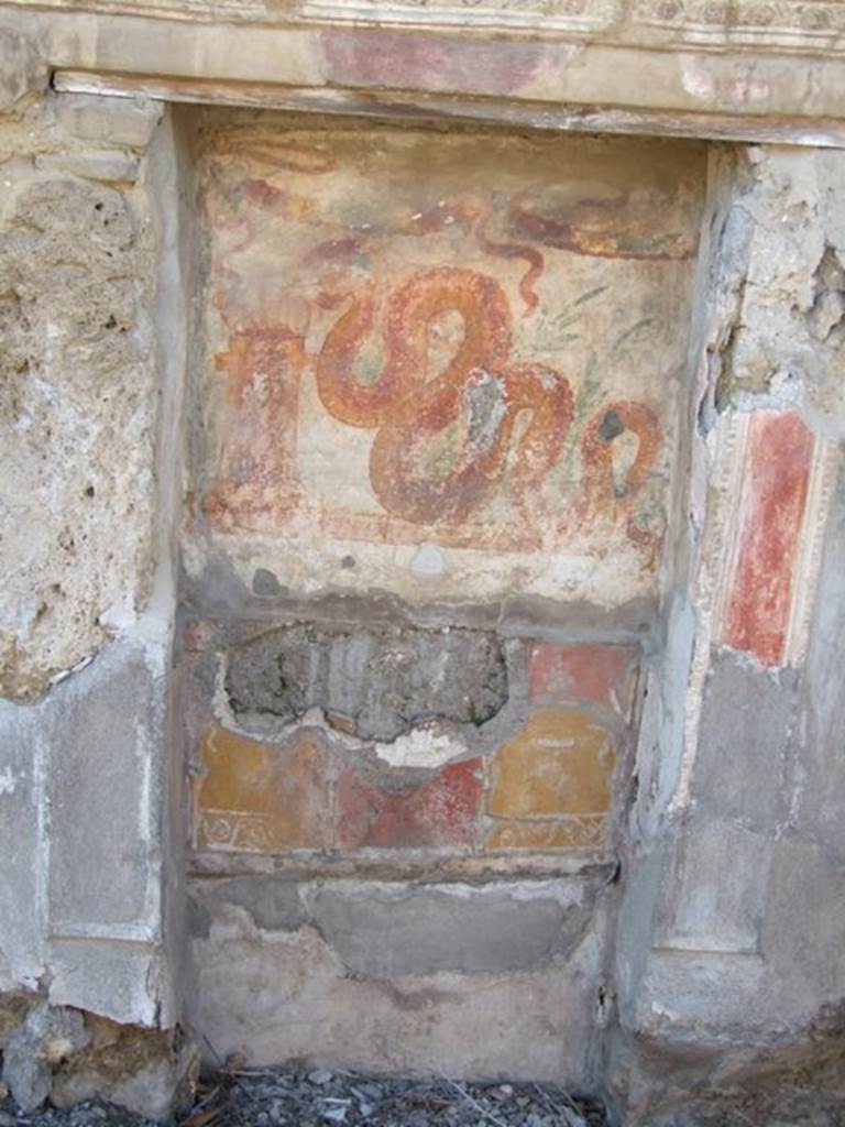V.3.7 Pompeii. March 2009. West wall of garden area.Aedicula lararium. Niche with upper and lower zones. The marks can be seen of the partition that separated the upper and lower zones. Also visible are the marks of a second partition that apparently formed the floor of the niche. See Boyce G. K., 1937. Corpus of the Lararia of Pompeii. Rome: MAAR 14.  (112, p. 38, Pl 36, 2).