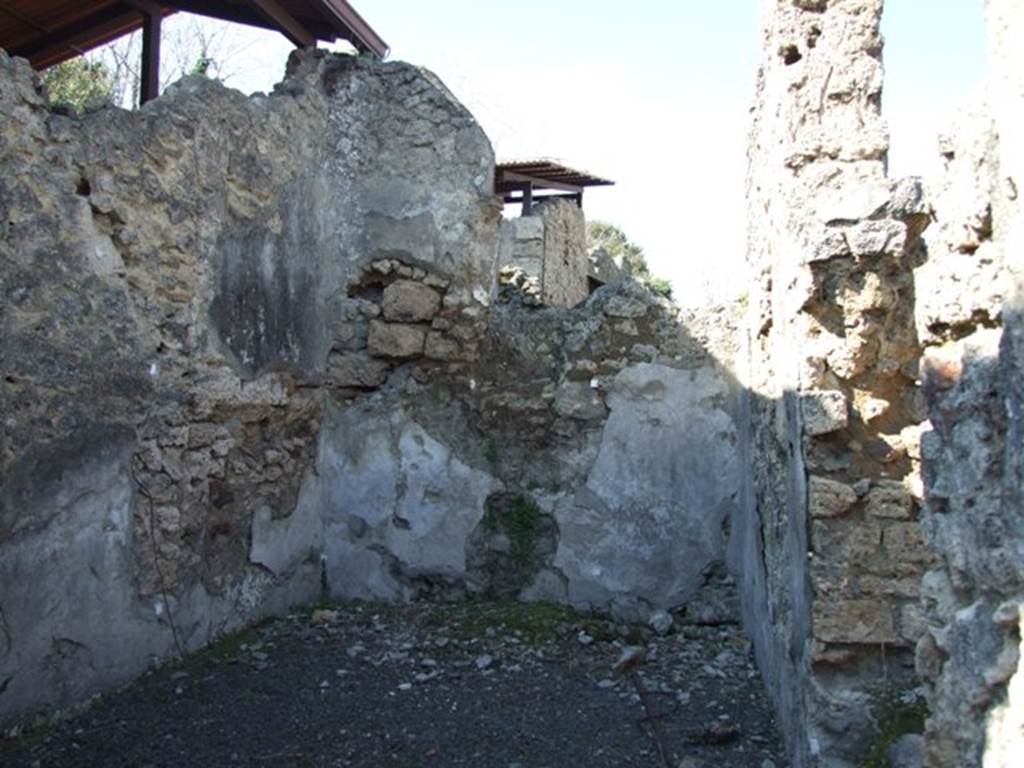 V.3.7 Pompeii. March 2009.Triclinium, north wall, in centre, with doorway to corridor in east wall, on right.