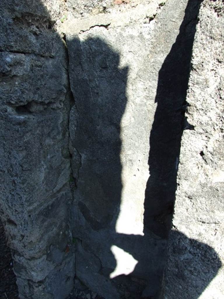 V.3.7 Pompeii.  March 2009.  Small cupboard in east wall of andron.