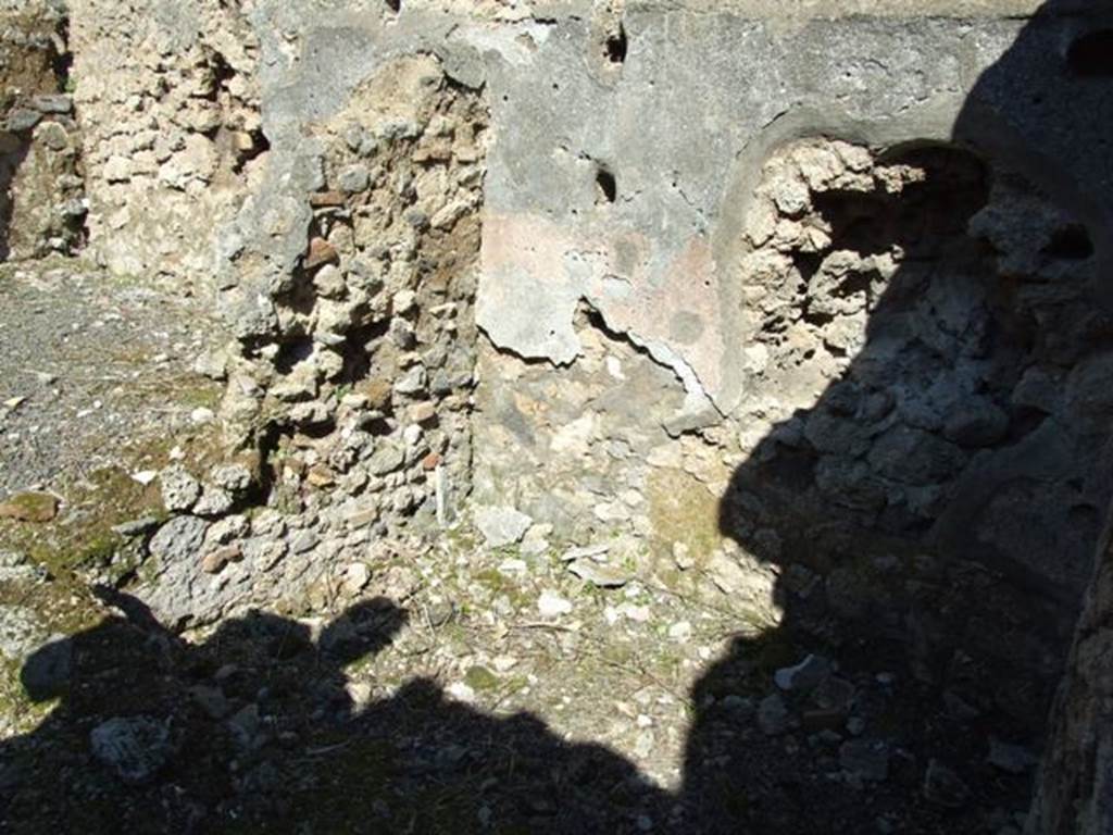 V.3.7 Pompeii.  March 2009.  Small storeroom on east side of andron, with shelving supports.