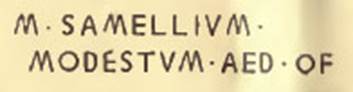 V.3.12 Pompeii. A tabella ansata, a plaque with dovetailed ends, was found in December 1902 on the left of the entrance doorway. Painted in black letters on this was the epigraph
M. SAMELLIVM MODESTVM AED. O. F.