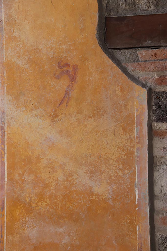 V.3 Pompeii. Casa del Giardino. October 2022.
Portico 10, looking towards west wall at south end of doorway to room 7, painted decoration.
Photo courtesy of Klaus Heese.