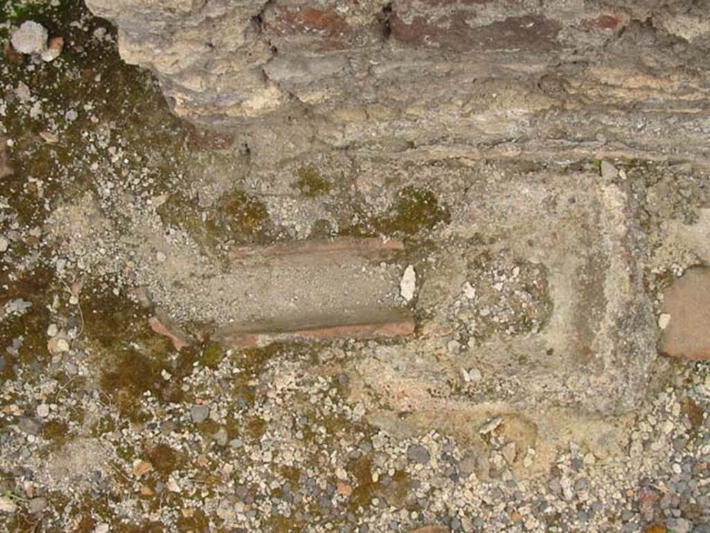 V.4.7 Pompeii. May 2003. Detail from side of stone bench or hearth. Photo courtesy of Nicolas Monteix.