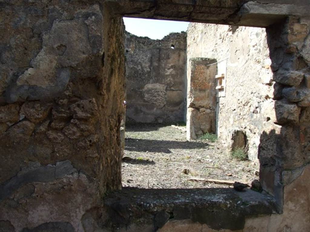 V.4.9 Pompeii. March 2009. West wall of triclinium with window across atrium.