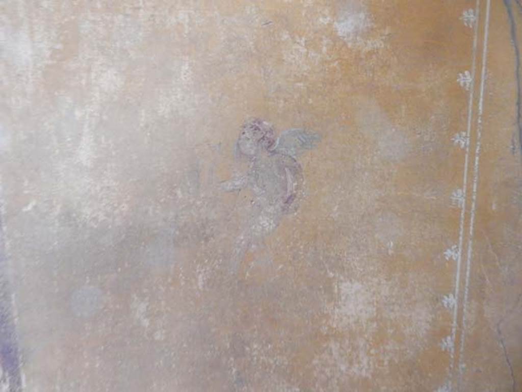 V.4.a Pompeii. May 2015.  Room ‘i’, detail of figure on south end of east wall of cubiculum. Photo courtesy of Buzz Ferebee.