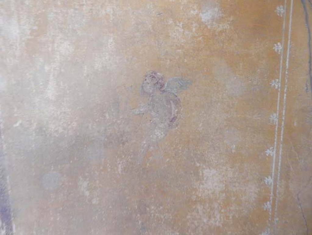 V.4.a Pompeii. May 2015.  Room ‘i’, detail of figure on south end of east wall of cubiculum. Photo courtesy of Buzz Ferebee.