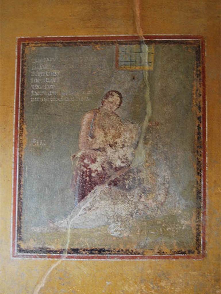 V.4.a Pompeii. May 2014. 
Room ‘i’, wall painting of Pero suckling her father Micone from centre of south wall of cubiculum. 
A Latin inscription in white letters can be seen in the top left corner.
Photo courtesy of Paula Lock.
