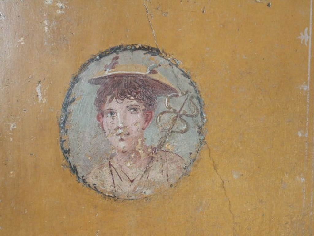 V.4.a Pompeii. December 2005. Wall painting of boy with the attributes of Mercury (winged helmet and caduceus).From cubiculum on south side of tablinum

