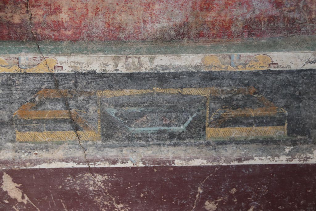 V.4.a Pompeii. October 2023. Room ‘g’, detail of garden painting in predella in centre of east wall. Photo courtesy of Klaus Heese. 