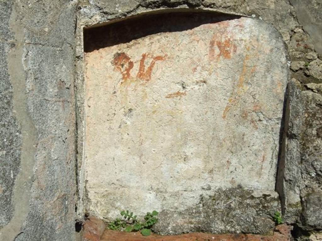 V.4.b Pompeii. March 2009. Painted Lararium niche.
According to Boyce, within the niche and on the surrounding wall was the Lararium painting, on a background of yellow.
On the back wall of the niche the Genius poured a libation upon a cylindrical altar on the opposite side of which stood the tibicen.
See Notizie degli Scavi di Antichità, 1901, 331; Rom.Mitt., xvi, 1901, 362.
See Boyce G. K., 1937. Corpus of the Lararia of Pompeii. Rome: MAAR 14. (p.42, no.129, Pl.13,1) 

 