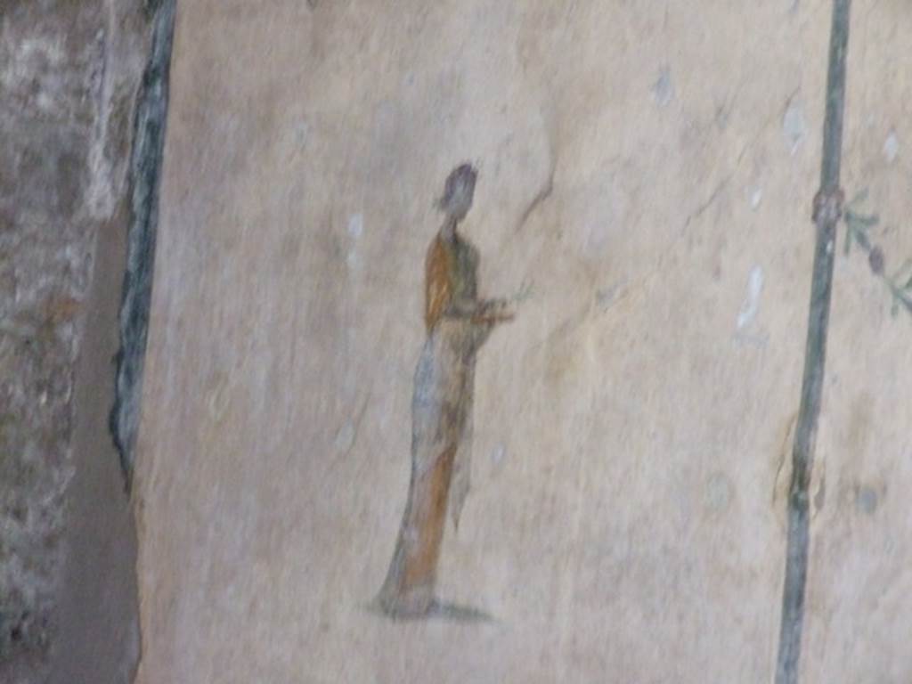 V.5.3 Pompeii. March 2009. Room 6, wall painting of female figure on north end of middle panel of east wall of triclinium.
